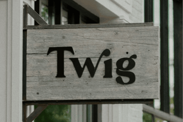 close up of wood and metal sign at Twig Hair Salon Boulder, Colorado